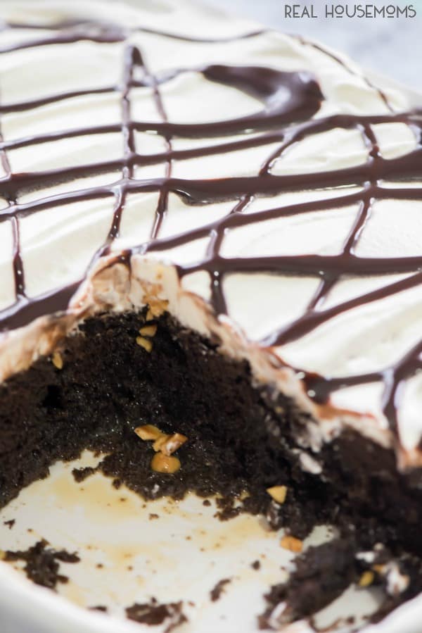 Snickers Poke Cake blew our minds. This dessert recipe is so easy to make the kids can even get in on the action! Add more chocolate to your life with this cake!