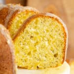 square image of the side view of sour cream orange cake slices cut from the cake