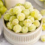 square image of sour patch grapes in a bowl