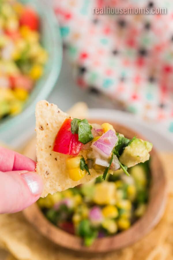 southwest corn salsa on a chip over a bowl