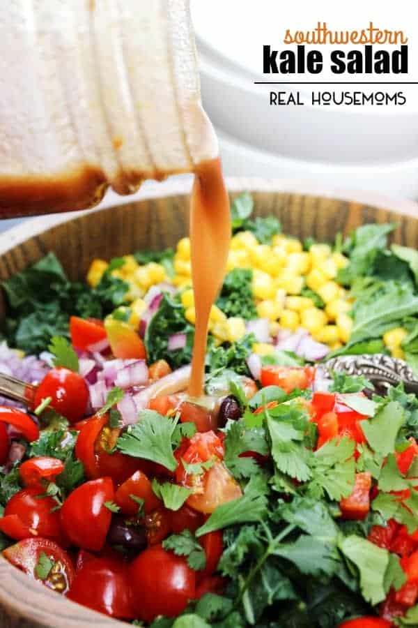 SOUTHWESTERN KALE SALAD is made with a variety fresh vegetables and kale tossed in a cumin vinaigrette for a summer side you can't beat!