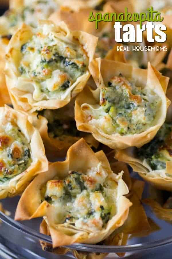 Spanakopita Tarts have all the same great flavor you love in a small grab and pop appetizer! These tarts are elegant enough for the holiday season, and will go perfectly with all your other bite-sized morsels!