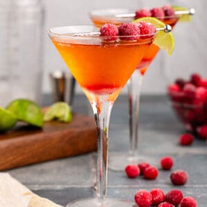 square image of two sparkling cranberry martinis