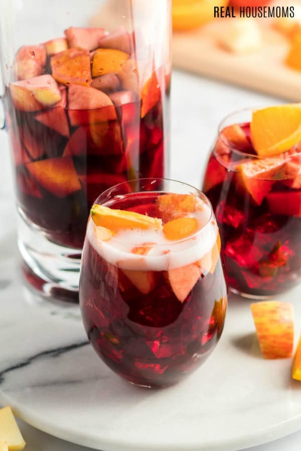 glasses of sparkling red wine sangria with fruit