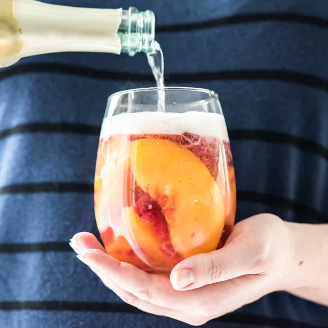 Sparkling White Peach Sangria is a great brunch or summer cocktail! Making it ahead makes it a great recipe for a party and the taste is fantastic!