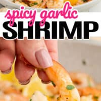 top picture is spicy garlic shrimp in a skillet with lemon wedges, bottom picture is a single piece of spicy garlic shrimp being held by a woman hand with pink and black lettering in the middle of the image