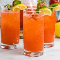 tall glasses with spiked strawberry lemonade
