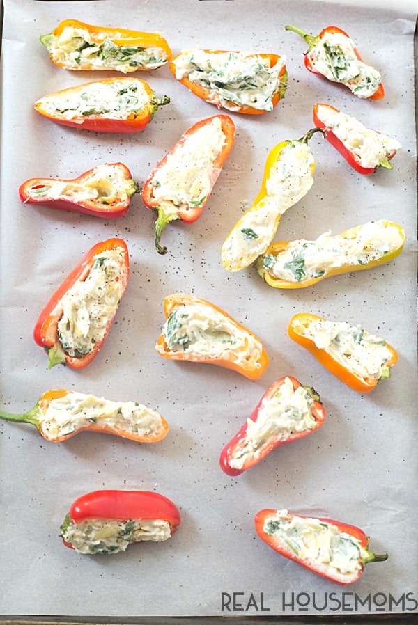SPINACH & ARTICHOKE STUFFED MINI PEPPERS are little bites of summer goodness that will make you a star at your next picnic, potluck, or summer barbecue! 