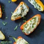 SPINACH & ARTICHOKE STUFFED MINI PEPPERS are little bites of summer goodness that will make you a star at your next picnic, potluck, or summer barbecue!
