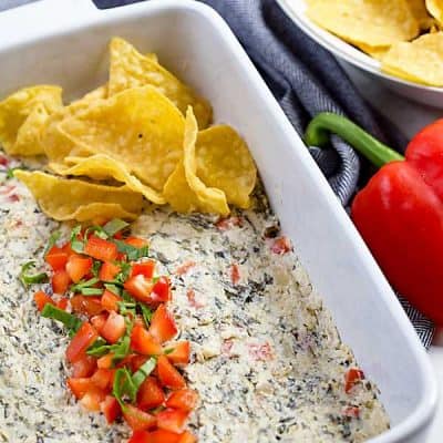 Spinach Bell Pepper Dip is a warm cheesy dip that tastes amazing! Garlic, cream cheese, sour cream and mozarella cheese make the best dip for parties!
