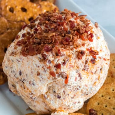 Be the talk of every party you attend! It's as easy as bringing this Sriracha Bacon Ranch Cheese Ball loaded with bold flavors!