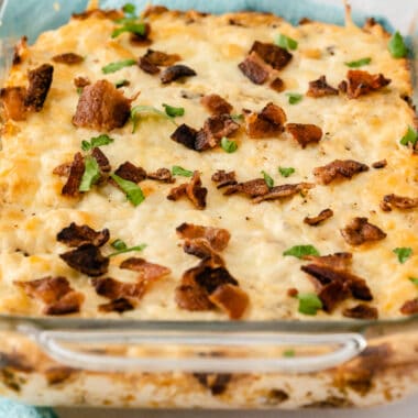 square image of sriracha ranch bacon chicken dip in a glass baking dish
