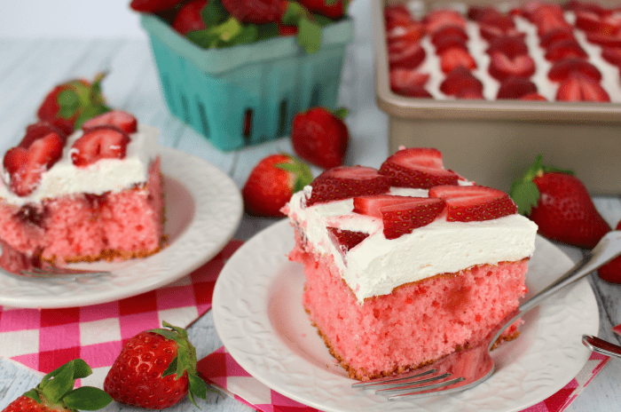 The most amazing strawberry cake, ever! Moist, sweet cake drizzled with strawberry jam, layered with a delicious cream cheese whipped topping and topped with fresh, sliced strawberries! Perfect any time you're in the mood for a delicious berry dessert!