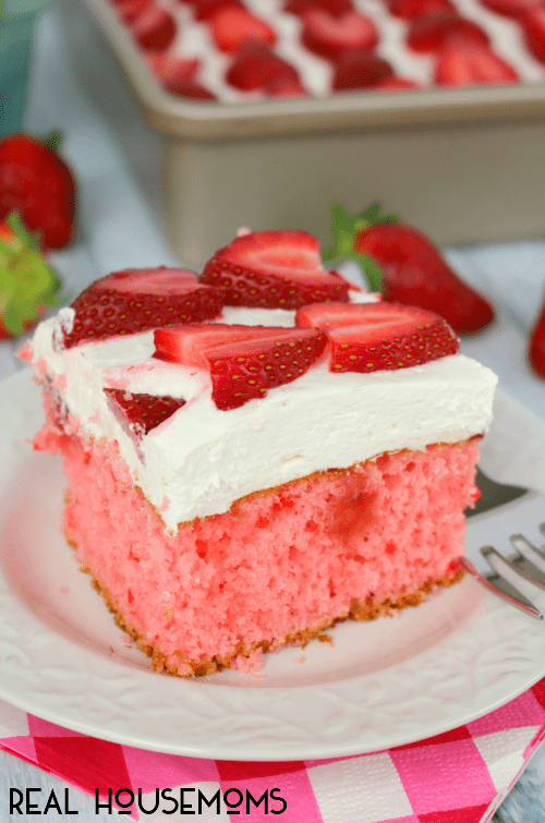This STRAWBERRIES AND CREAM POKE CAKE is the most amazing strawberry cake, ever! Perfect anytime you're in the mood for a delicious berry dessert!