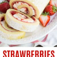 strawberries and cream swiss roll on a serving platter with recipe name at the bottom