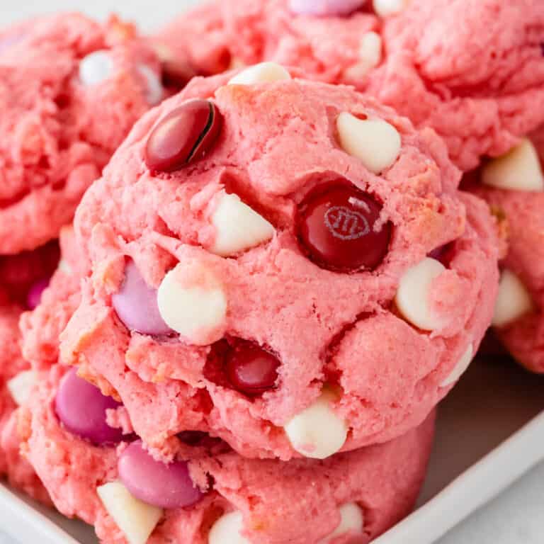 square close up image of strawberry cake mix cookies on a plate