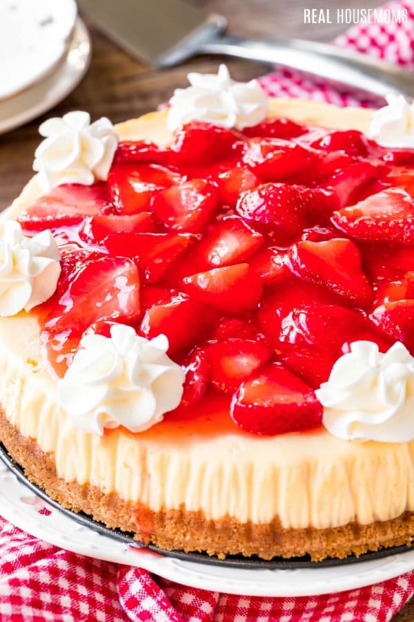 side view of whole strawberry cheesecake