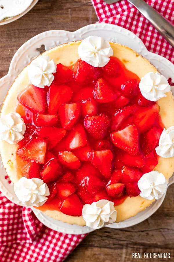 looking down at strawberry cheesecake with whipped cream