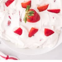lookign down at a bowl of strawberry cheesecake fluff with recipe name at the bottom