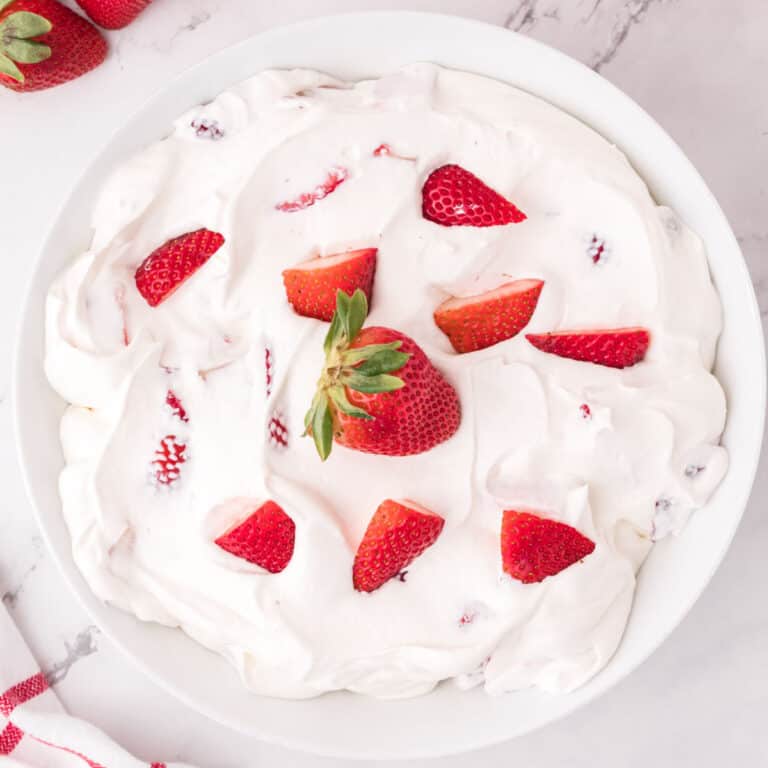 square image looking down at a bowl of strawberry cheesecake fluff