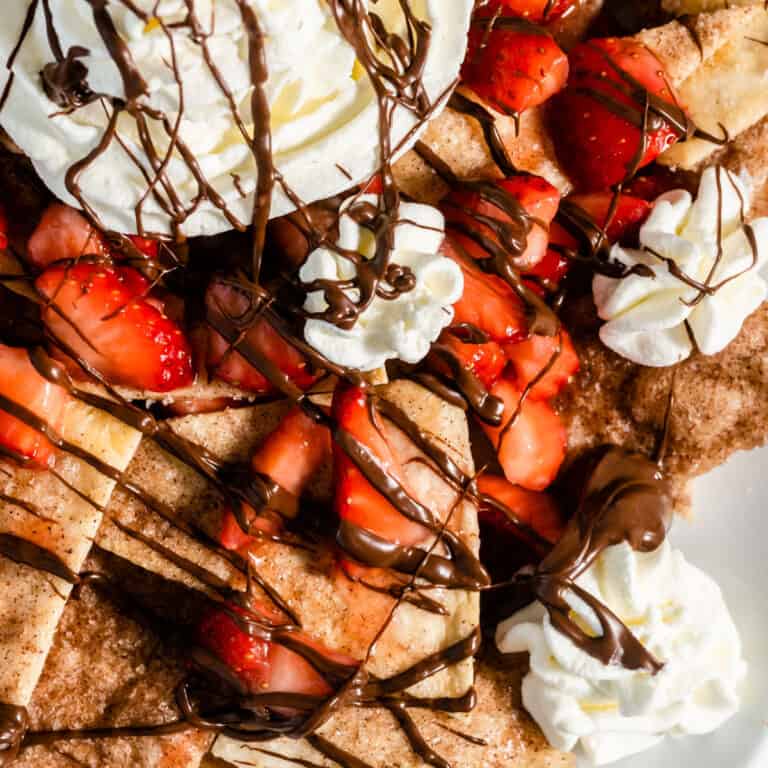 square image close up of strawberry dessert nachos