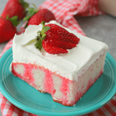 Cool and creamy, this Strawberry Jello Cake is the ultimate summertime dessert! It'll be your new favorite dessert for cookouts and pot-lucks!