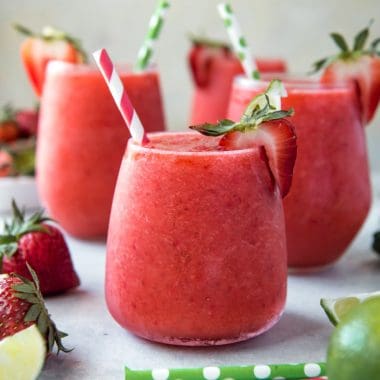 Cold and refreshing, this Strawberry & Lime Moscato Wine Slushie is a summertime sipper's dream! Sweet strawberries are blended with fresh tart lime juice and a healthy dose of Moscato for a fantastic summer cocktail!
