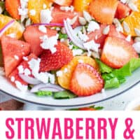 strawberry & mandarin orange salad in a bow with recipe name at the bottom