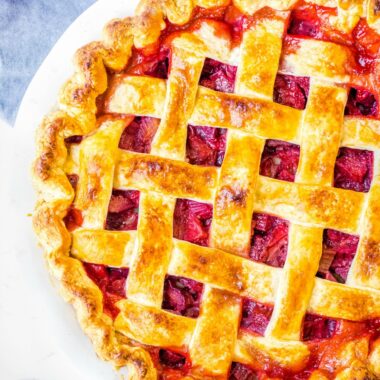 Strawberry Rhubarb Pie is sweet, tart & delicious with a scoop of vanilla ice cream. Learn all my tips for the perfect pie every time!