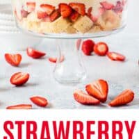 side view of strawberry shortcake trifle in a trifle bowl with recipe name at the bottom