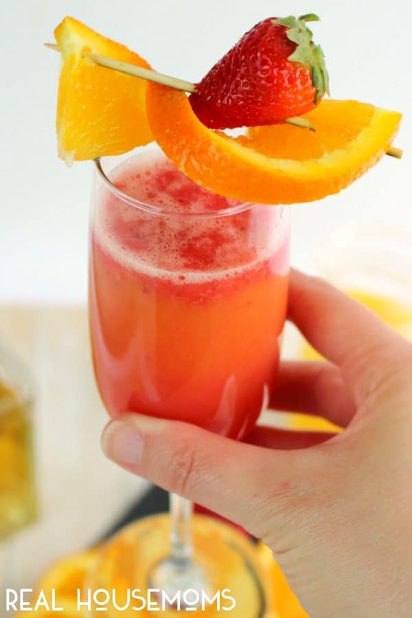 Need a new brunch cocktail? This fantastic Strawberry Tequila Sunrise recipe is an amazing drink perfect for brunching with friends. Made with just a few ingredients, this easy tequila drink is great for happy hour, cocktail time and parties, too!