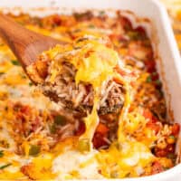 square image of a spoonful of stuffed pepper casserole over the baking dish