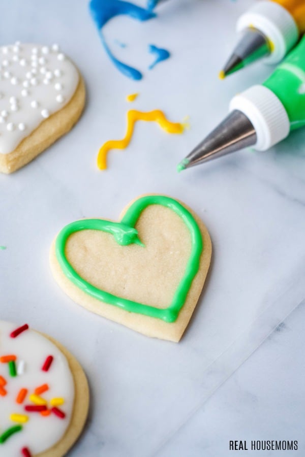 cut out cookie outlined with sugar cookie icing