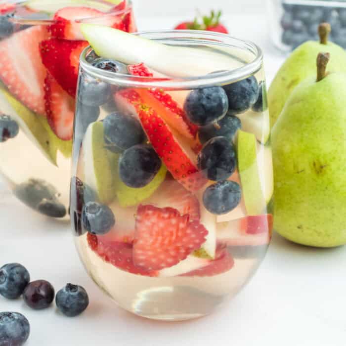 square image of a stemless wine glass of summer punch