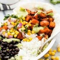 Easy and healthy Sweet Potato Burrito Bowls are full of fresh veggies and bold Tex-Mex flavors the whole family will love!