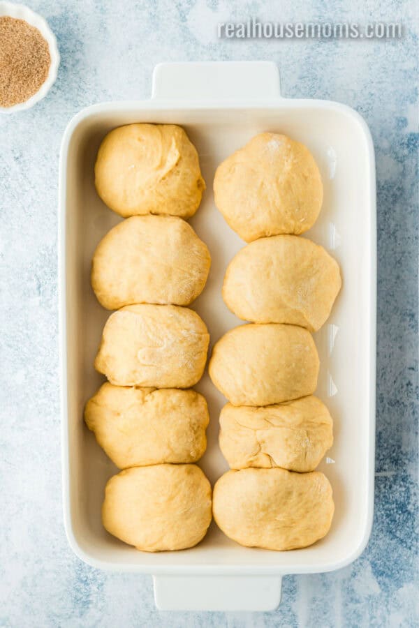 sweet potato dinner roll dough balls in a baking dish