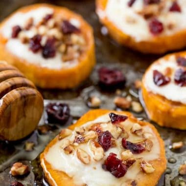 Delight your holiday guests with Sweet Potato Rounds with Goat Cheese! They're loaded with fall flavors for the perfect party bite!