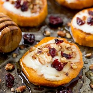 Delight your holiday guests with Sweet Potato Rounds with Goat Cheese! They're loaded with fall flavors for the perfect party bite!