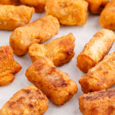 square image of sweet potato tots on a baking sheet