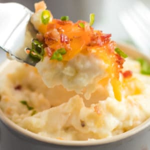 Cheesy, loaded with bacon, and individually portioned - Mini Twice Baked Potato Casserole are the best way to serve mashed potatoes to a crowd!