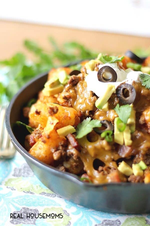 Loaded Tater Tot Nachos make a scrumptious appetizer or snack EVERYONE loves! Crispy potatoes smothered in seasoned meat and melted cheese - yes, please!
