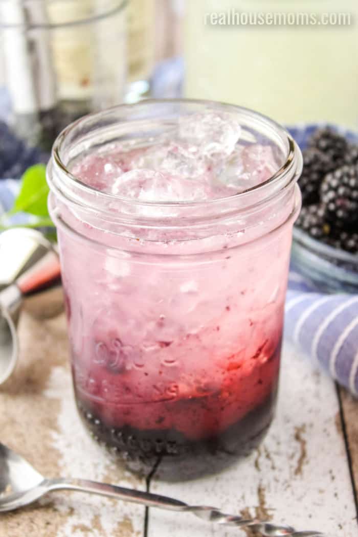 layered blackberry hard lemonade in a mason jar