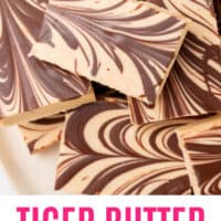 tiger butter fudge piled on a plate with recipe name at the bottom