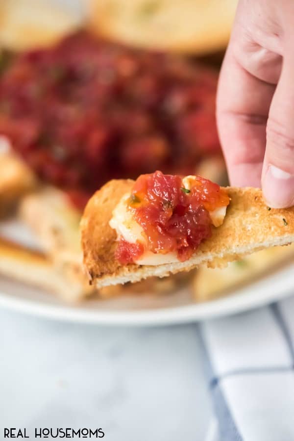 Tomato Jam is a simple appetizer recipe that can be used for any occasion! Serve it up while watching the game, cocktails with friends or the holidays! It will be the hit of the party!