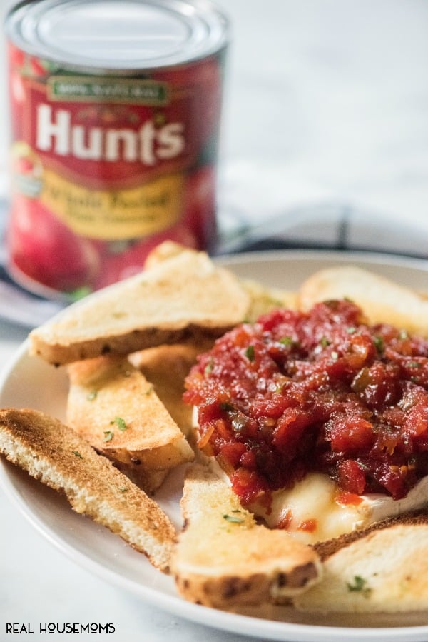 Tomato Jam is a simple appetizer recipe that can be used for any occasion! Serve it up while watching the game, cocktails with friends or the holidays! It will be the hit of the party!