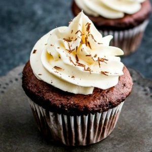 These decadent Triple Chocolate Cupcakes are filled with a creamy chocolate ganache and topped with a luscious white chocolate frosting!