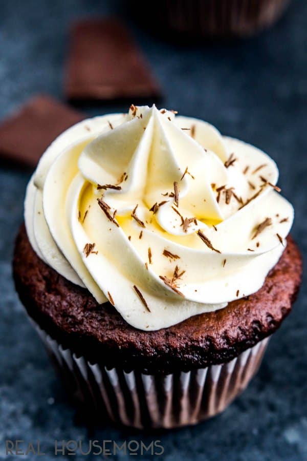 Triple Chocolate Cupcake with white chocolate frosting and chocolate shavings on top