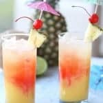 This TROPICAL PARTY PUNCH RECIPE will have you feeling like you're sitting on a warm, sunny beach. It's an easy non-alcoholic party punch recipe everyone can enjoy!