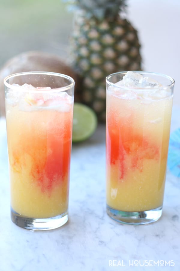 This TROPICAL PARTY PUNCH RECIPE will have you feeling like you're sitting on a warm, sunny beach. It's an easy non-alcoholic party punch recipe everyone can enjoy!