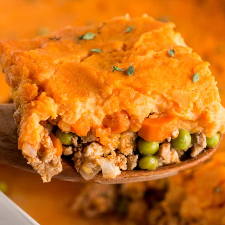 square image of portion of Turkey & Sweet Potato Shepherd's Pie on a wooden spatula